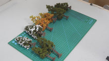 Load and play video in Gallery viewer, 12/15cm Miniature Four Seasons Pine Tree Model HO N Scale Metasequoia for Train Railway Diorama Landscape Dollhouse Terrarium Craft Supply
